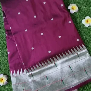Handloom pure silk triple muniya Paithani saree in deep maroon with silver zari border and intricate patterns.