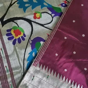 Handloom pure silk triple Muniya Paithani saree with colorful floral patterns and a contrasting border design.