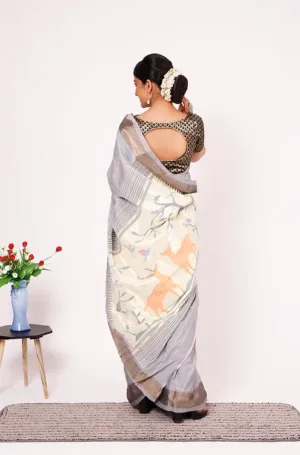 Grey handloom pure cotton Paithani saree with soft silver border and artistic bird motifs on pallu, worn by woman