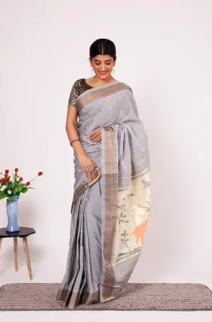 Grey handloom pure cotton Paithani saree with subtle zari border and traditional woven pallu, worn by woman