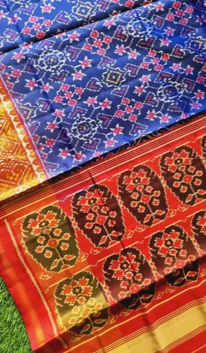 Mulberry silk handcrafted single ikat Patola saree in blue and red with traditional geometric woven motifs