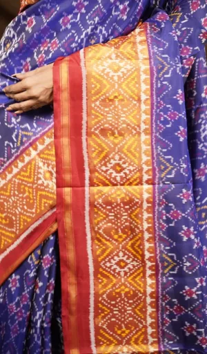 Mulberry silk handcrafted single ikat Patola saree in blue with red and gold woven border and traditional motifs