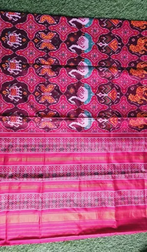 Mulberry silk handcrafted single ikat Patola saree in pink and maroon with traditional geometric motifs