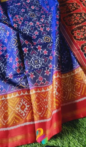 Mulberry silk handcrafted single ikat Patola saree in royal blue and red with traditional geometric woven motifs