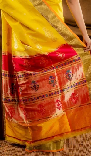 Turmeric yellow handloom pure silk Paithani saree with red and gold zari pallu featuring traditional floral motifs