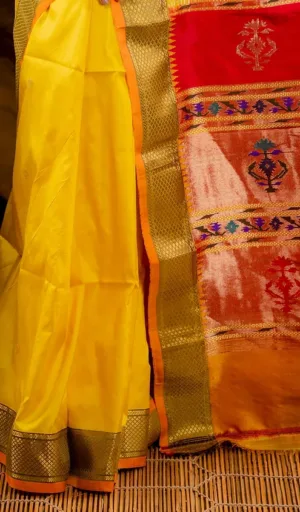 Turmeric yellow handloom pure silk Paithani saree with rich gold zari border and multicolour traditional woven pallu